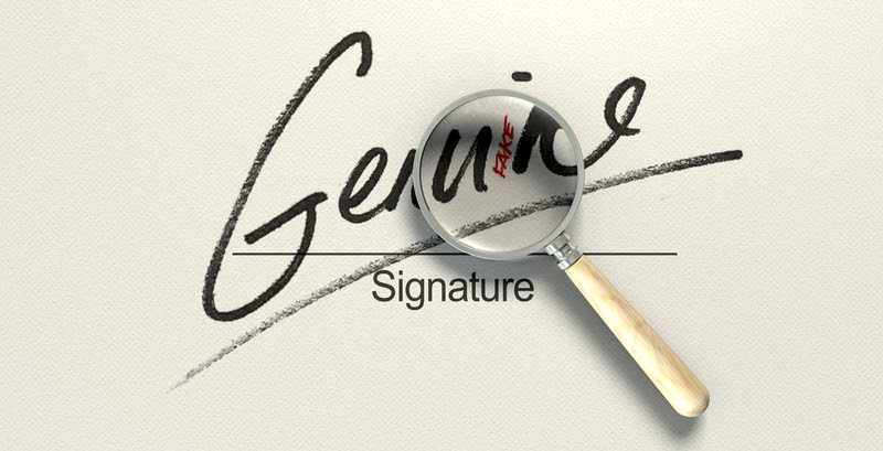 a magnifying glass examining a signature